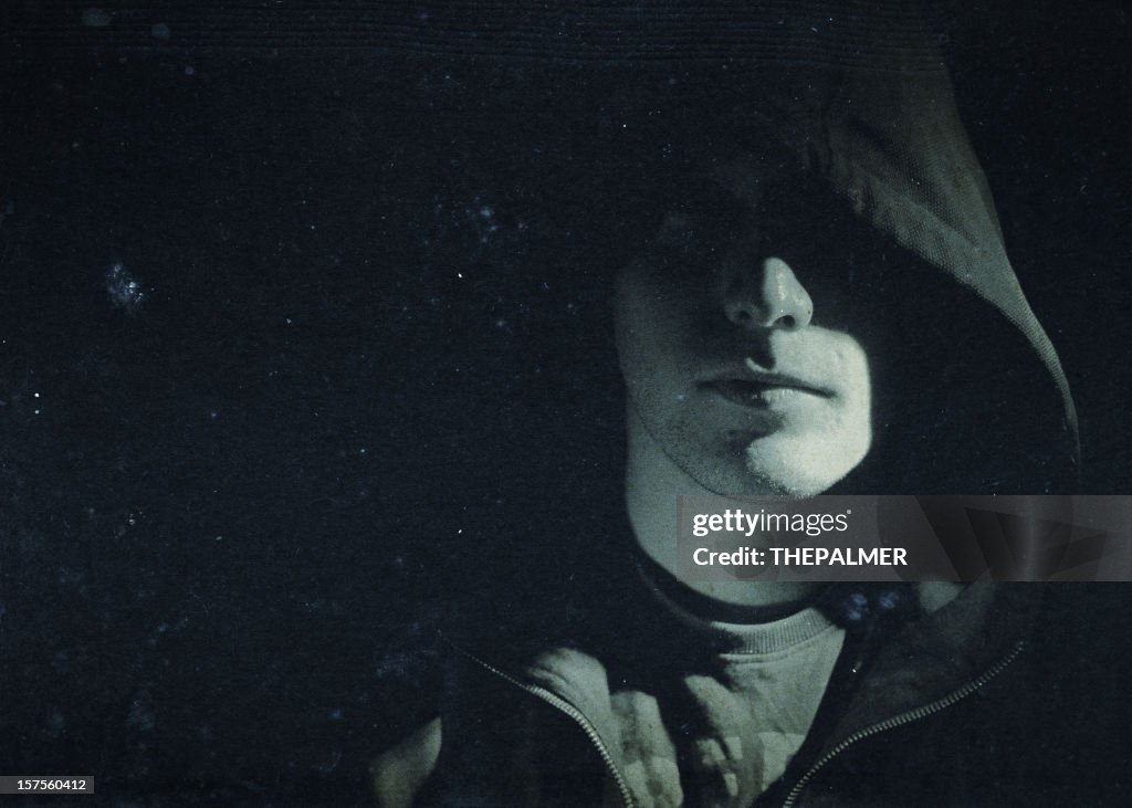Mysterious man hidden under a hooded shirt
