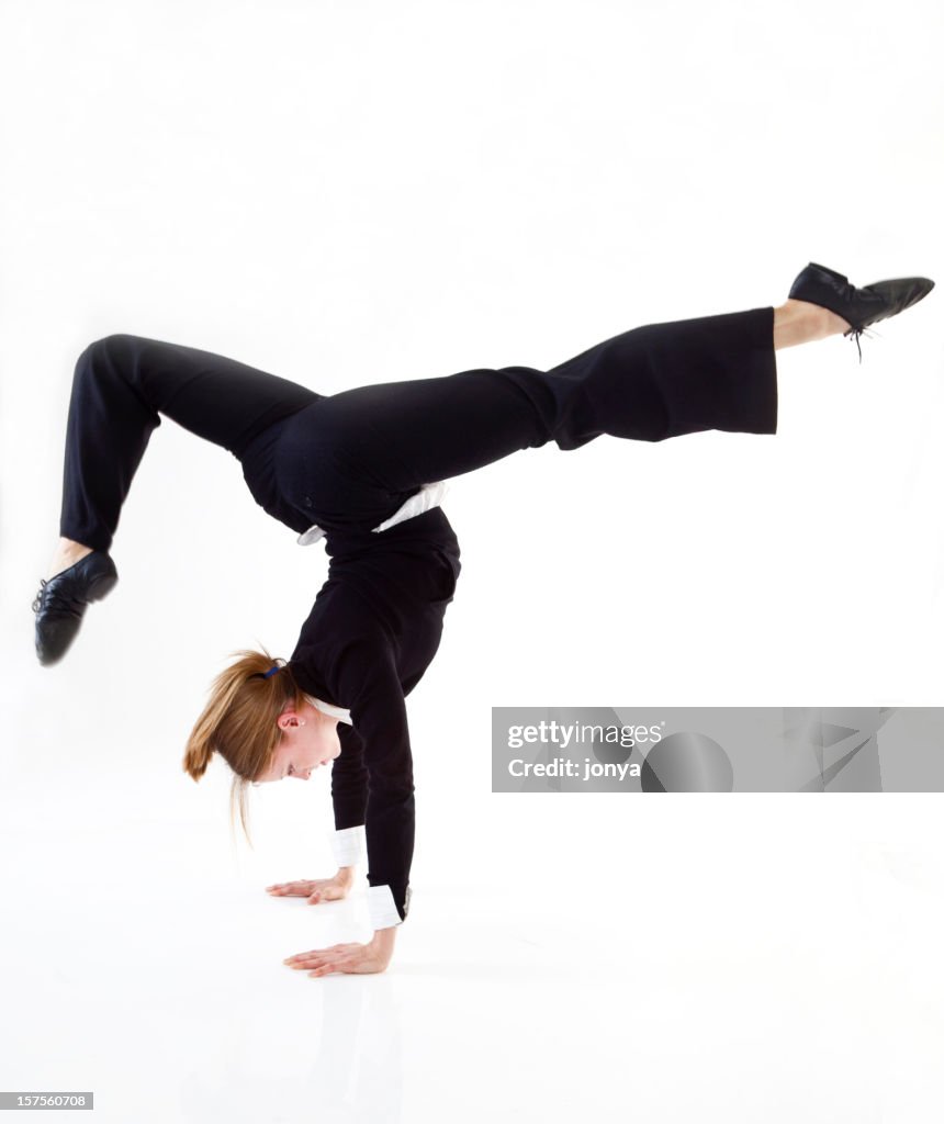 Businesswoman doing a hand stand