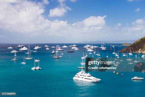 luxury yachts at anchor in the caribbean harbor - yachting stock pictures, royalty-free photos & images