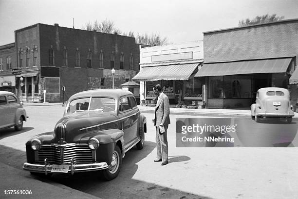 main street of small town usa with cars 1941, retro - black and white photo stock pictures, royalty-free photos & images