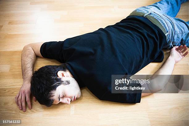 fainted man - drunk guy stock pictures, royalty-free photos & images