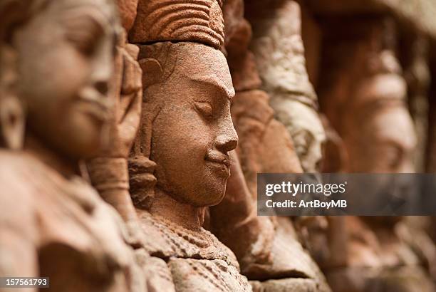 stone gesichter - buddhist goddess stock-fotos und bilder