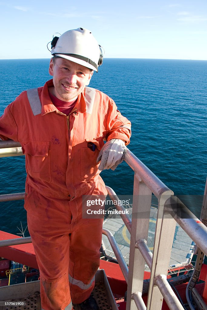 Man Riding On Rigs Portraits Of Man In Orange Jumpsuit On An Oil Rig High-Res Stock Photo ...