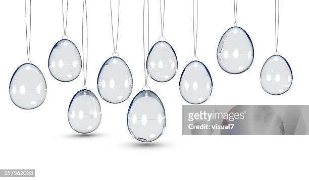 bunch of glass easter eggs hanging on a chain - translucent glass stock pictures, royalty-free photos & images
