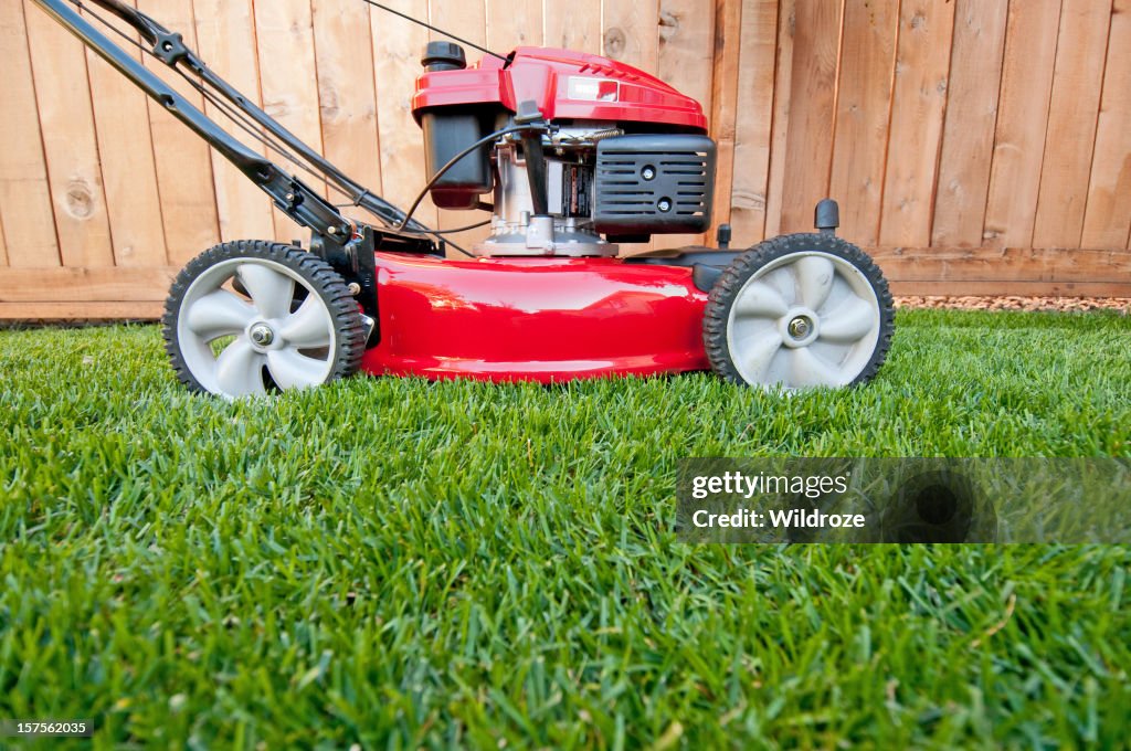 Bright red lawn mower ready for business