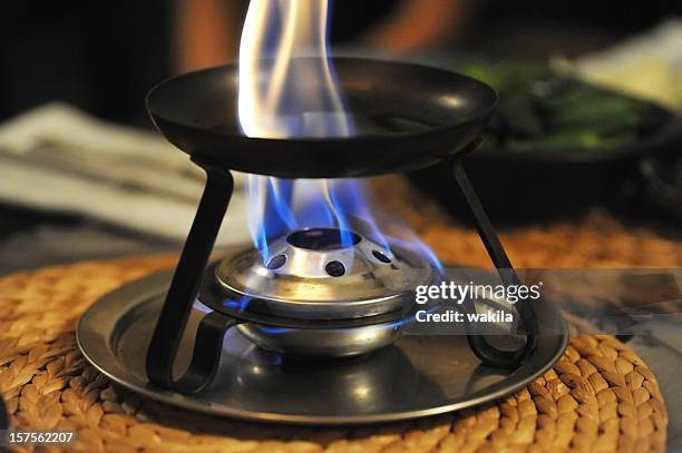 preparing fondue preparation - fondue stock pictures, royalty-free photos & images