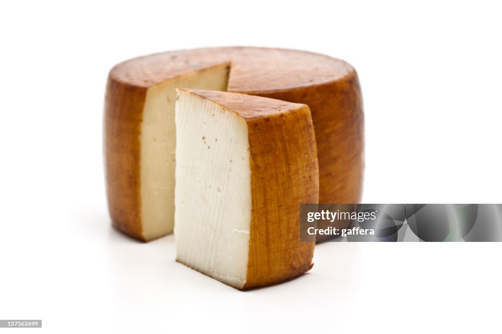 Italian pecorino cheese wheel with wedge removed