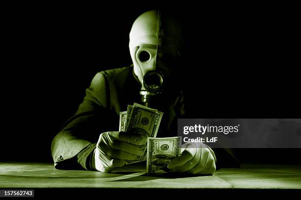 rich man in radiations - climate change money stock pictures, royalty-free photos & images