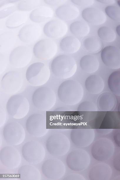 bola de golfe close-up - dimple texture - fotografias e filmes do acervo