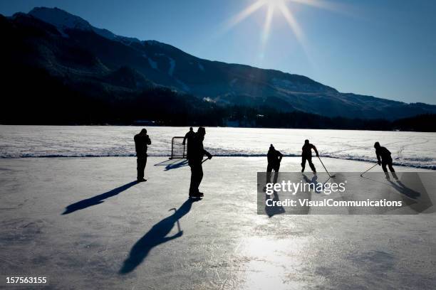 pond hockey. - pond hockey stock pictures, royalty-free photos & images