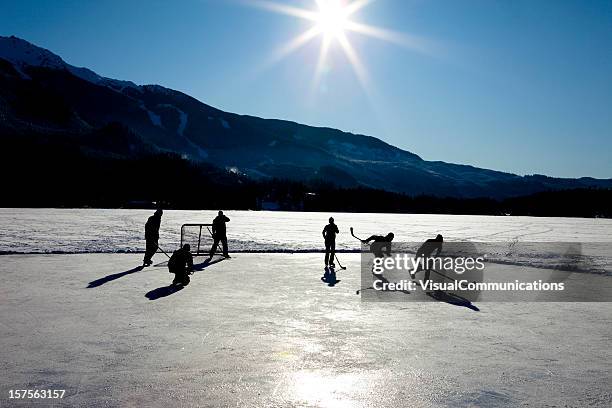 pond hockey. - outdoor ice hockey stock pictures, royalty-free photos & images