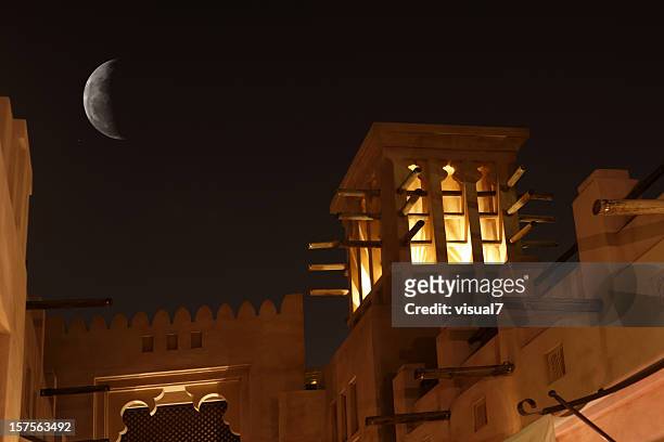 arabic wind tower in the night - deira stock pictures, royalty-free photos & images