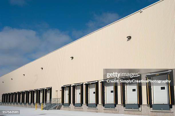 warehouse loading docks - industrial doors stock pictures, royalty-free photos & images