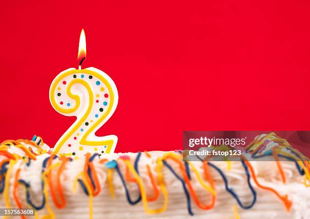 decorated cake with number 2 burning candles - number 2 stock pictures, royalty-free photos & images