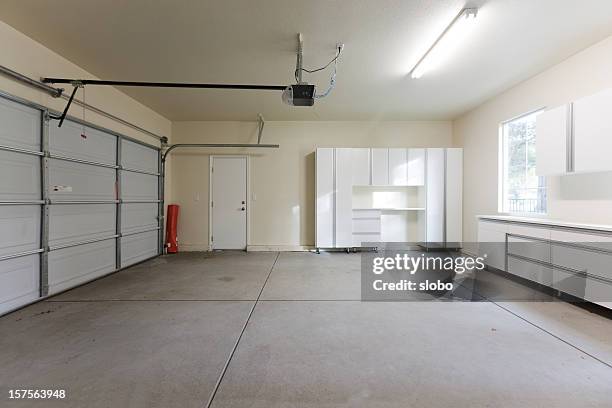 empty garage closed - garage doors stock pictures, royalty-free photos & images