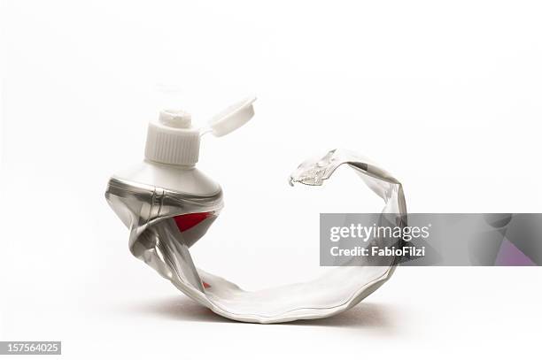 empty toothpaste - tube stockfoto's en -beelden