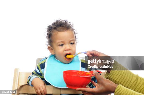 weaning baby having homemade food - high chair isolated stock pictures, royalty-free photos & images