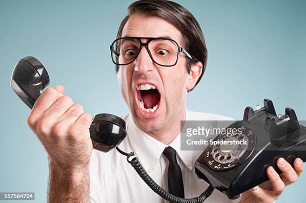 nerd de escritório com telefone antigo trabalhador - disrespect imagens e fotografias de stock