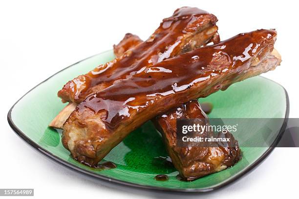 close-up of khrong moo yang on a green plate - spareribs stock pictures, royalty-free photos & images