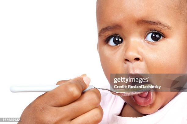 feeding baby - baby food stock pictures, royalty-free photos & images