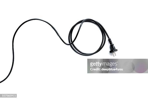 black electric cable with plug isolated on white - cable stockfoto's en -beelden