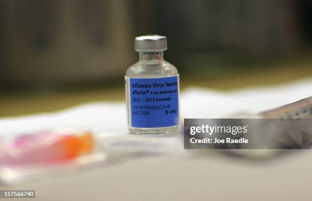 Bottle of influenza virus vaccine is seen at the CVS/pharmacy's MinuteClinic on December 4, 2012 in Miami, Florida. The Centers for Disease Control...