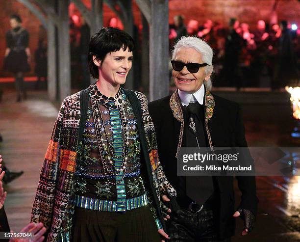 Karl Lagerfeld and Stella Tennant walk the runway at the CHANEL: Metiers d'Art fashion show at Linlithgow Palace on December 4, 2012 in Linlithgow,...