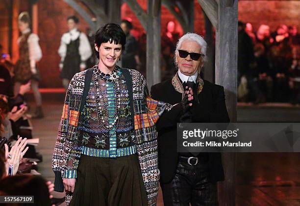 Karl Lagerfeld and Stella Tennant walk the runway at the CHANEL: Metiers d'Art fashion show at Linlithgow Palace on December 4, 2012 in Linlithgow,...