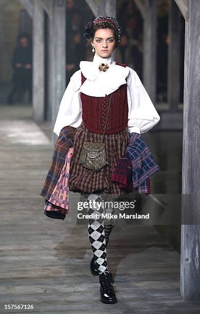 Model walks the runway at the CHANEL: Metiers d'Art fashion show at Linlithgow Palace on December 4, 2012 in Linlithgow, Scotland.