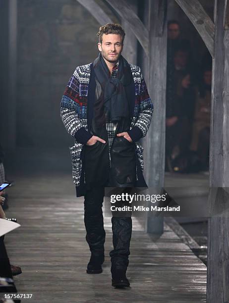 Model walks the runway at the CHANEL: Metiers d'Art fashion show at Linlithgow Palace on December 4, 2012 in Linlithgow, Scotland.