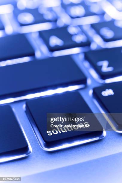 computer laptop keypad 'solutions' button. - solutions stock pictures, royalty-free photos & images