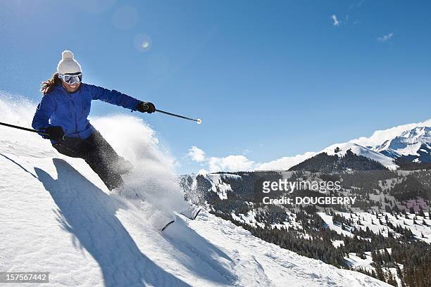 female skiing in powder snow - female skier stockfoto's en -beelden