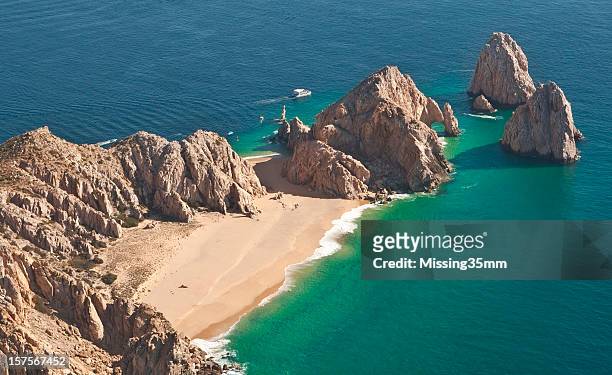 el arco and lover's beach aerial view - tor stock pictures, royalty-free photos & images