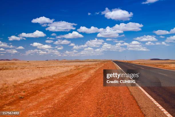 outback landscape with straight road - karijini national park stock pictures, royalty-free photos & images