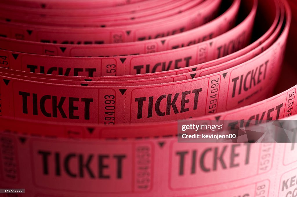 Close up of roll of pink ticket stubs