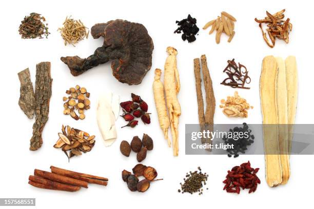 chinese medical herbs on white - ginseng stockfoto's en -beelden