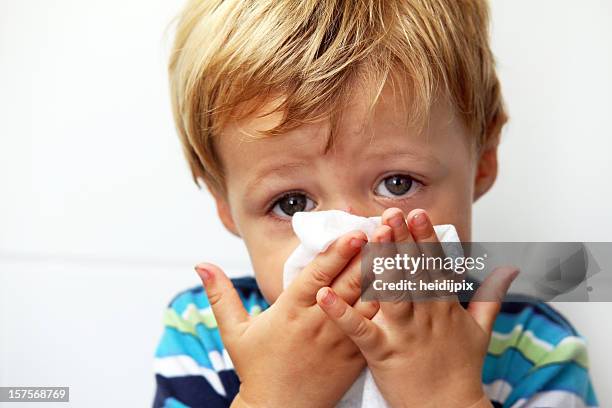 blowing nose - snuit stockfoto's en -beelden