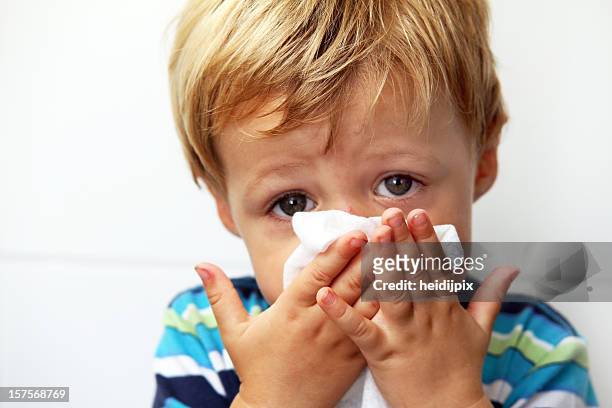 blowing nose - blowing nose stock pictures, royalty-free photos & images
