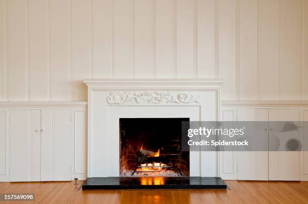 traditonal fireplace in empty room - fire pit stock pictures, royalty-free photos & images