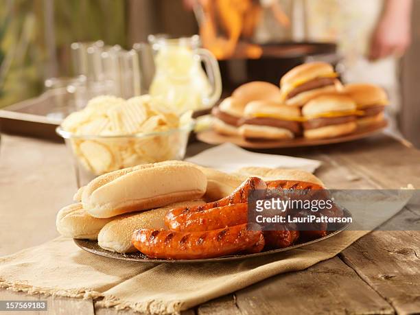 bbq hot dogs at a picnic - burger grill stock pictures, royalty-free photos & images