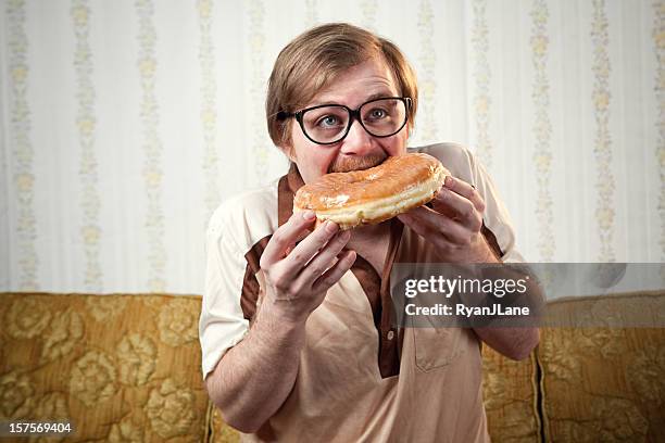 retro 1970's mustache man with huge donut - biting donut stock pictures, royalty-free photos & images