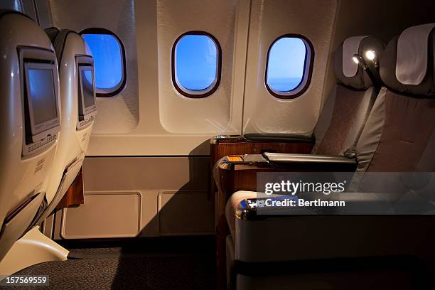 empty business class seats in an airplane - first class plane stockfoto's en -beelden