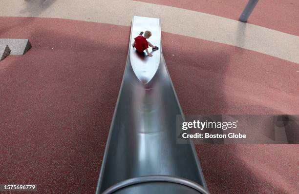 Boston, MA A boy comes down the slide at City Hall Plaza. A viral video of a BPD officer's bumpy ride on an extra-large slide at City Hall Plaza is...