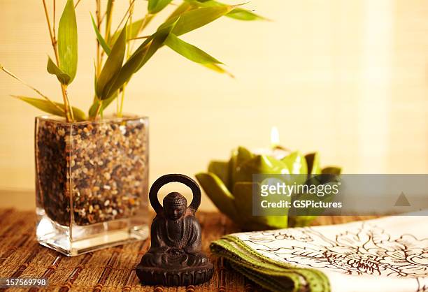 home decor still life of bamboo in vase  and buddha - feng shui house stock pictures, royalty-free photos & images