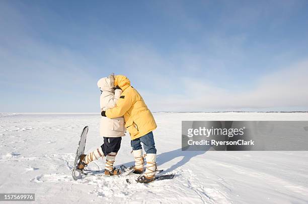 arctic kiss, yellowknife. - parka coat stockfoto's en -beelden
