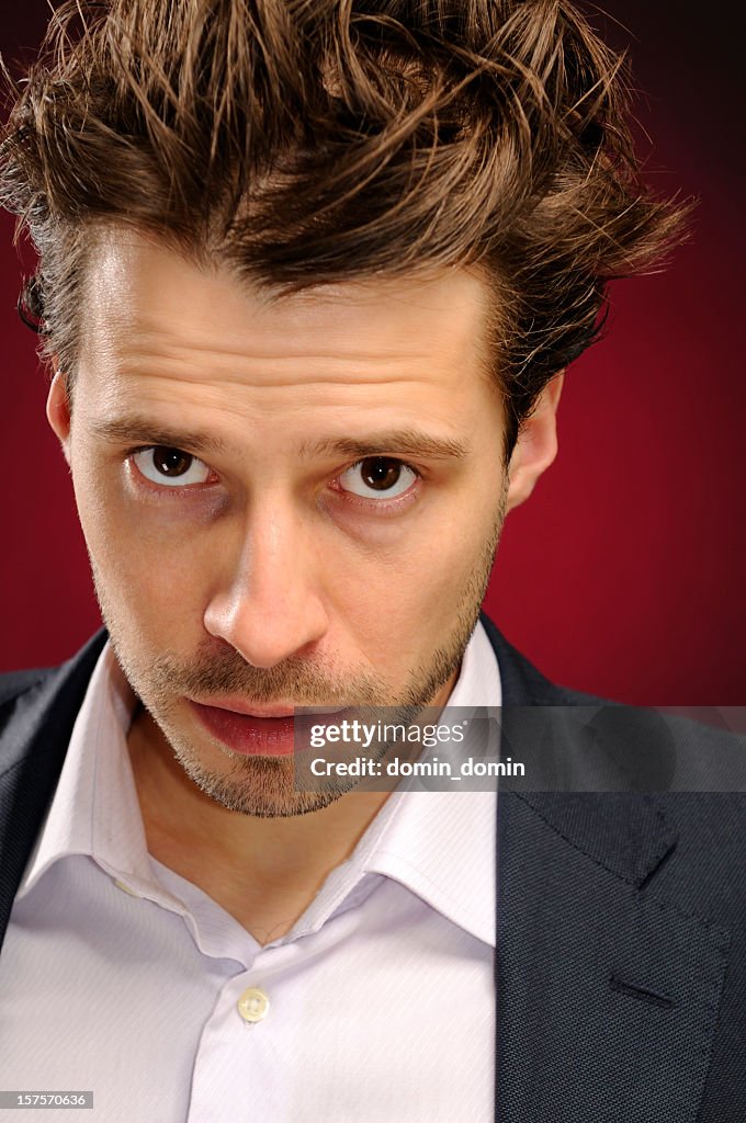 Portrait of young handsome man with matted hair