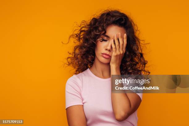 beautiful emotional woman - solemn face stock pictures, royalty-free photos & images