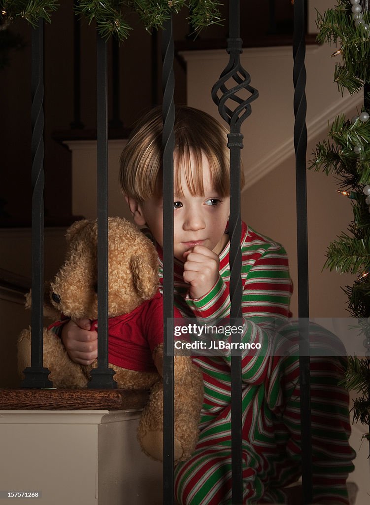 Little Boy On Staircase Watching Santa