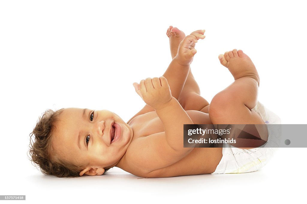 Baby liegen auf Zurück Lächeln und Blick in die Kamera