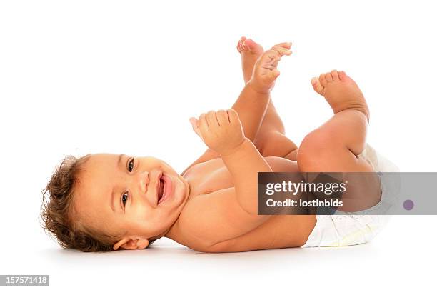 baby liegen auf zurück lächeln und blick in die kamera - baby on white stock-fotos und bilder